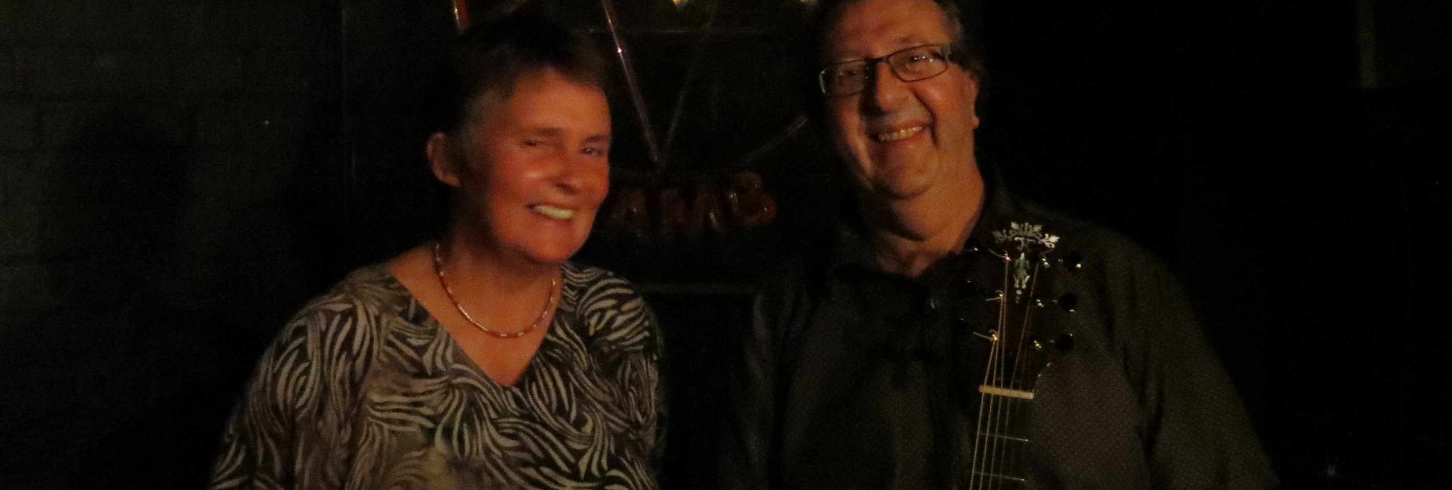 Lynn and Steve dark background blurred